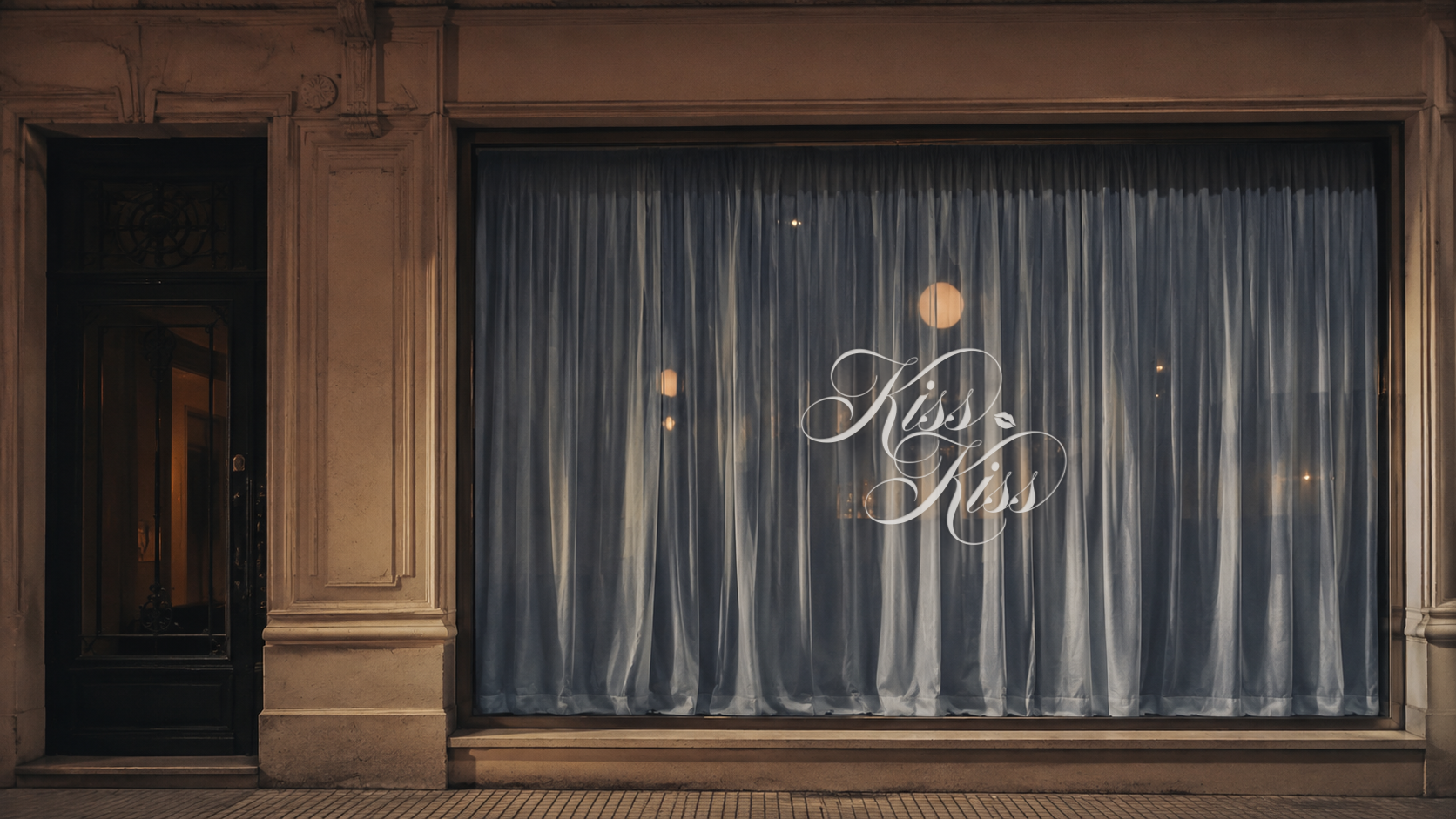 Kiss Kiss storefront with blue curtains